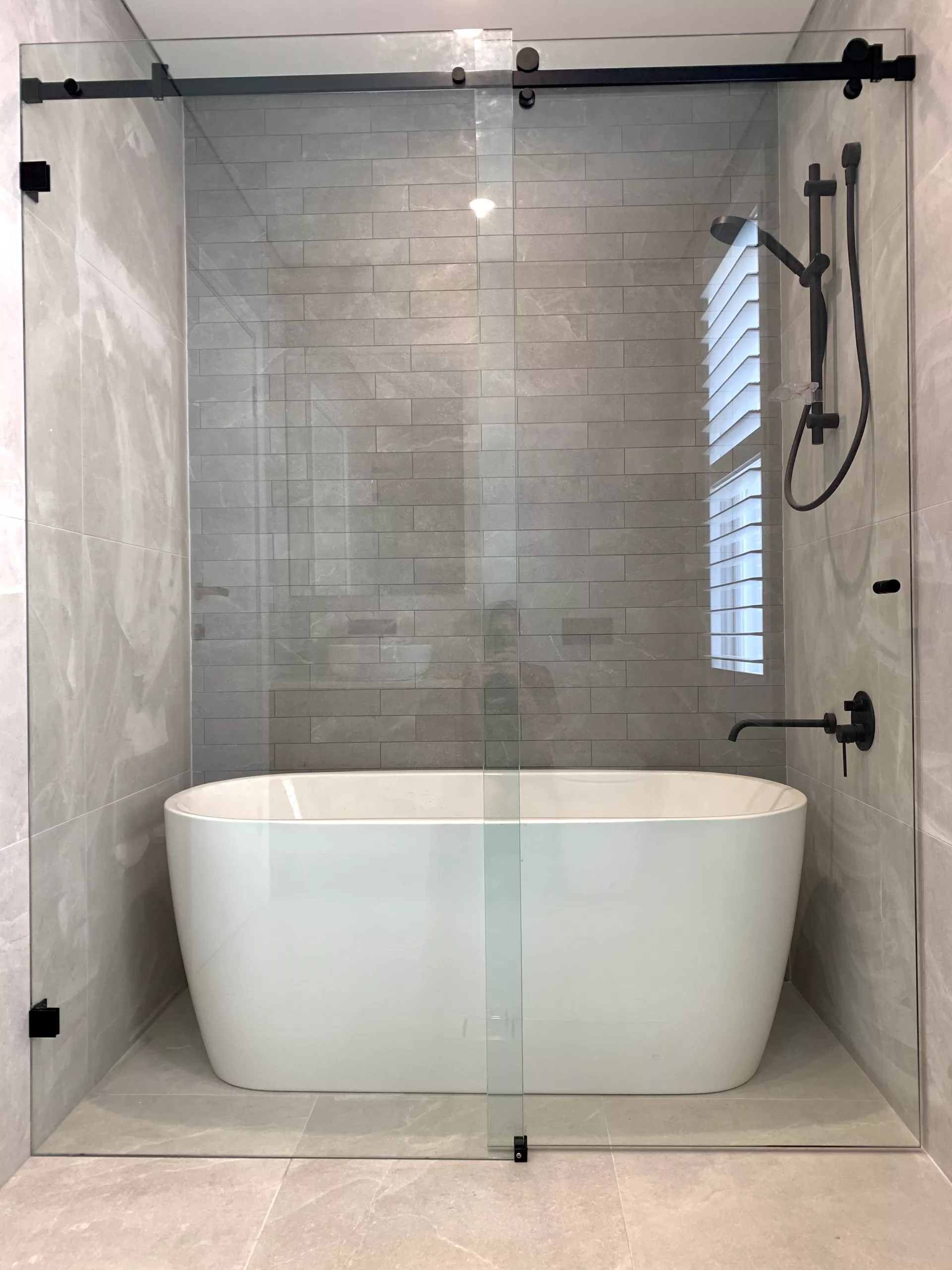 Glass wall to wall slider shower screen